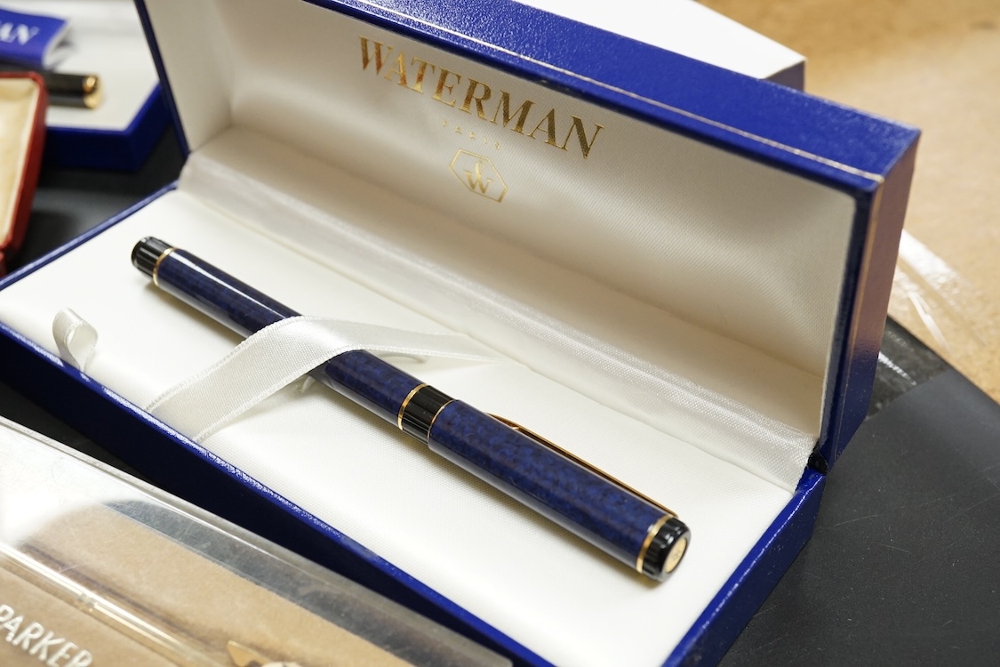 Four assorted cased Waterman pens, elven other assorted pens including Scheaffer and Parker and an engine turned silver pen.